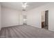 Large carpeted main bedroom leading to the ensuite bathroom and closet at 2834 N Paisley Ln, Casa Grande, AZ 85122