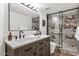 Modern bathroom featuring double sinks, a marble shower, and stylish fixtures at 3037 E Bighorn Ave, Phoenix, AZ 85048