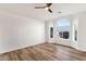 Bed room with wood flooring, neutral paint, modern ceiling fan, and lots of natural light at 3037 E Bighorn Ave, Phoenix, AZ 85048