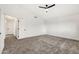 Carpeted bedroom featuring a ceiling fan and connecting door to a closet space at 3037 E Bighorn Ave, Phoenix, AZ 85048