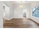 Bright dining room features an open layout with wood floors and access to the kitchen at 3037 E Bighorn Ave, Phoenix, AZ 85048
