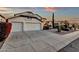 Well-maintained house features a spacious three-car garage, desert landscaping, and a long driveway at 3037 E Bighorn Ave, Phoenix, AZ 85048