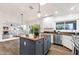Spacious kitchen with granite counters, a center island, stainless steel appliances, and skylights at 3037 E Bighorn Ave, Phoenix, AZ 85048