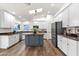 Spacious kitchen with a center island, granite counters, stainless appliances, and skylights at 3037 E Bighorn Ave, Phoenix, AZ 85048
