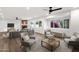 Bright and open living room features recessed lighting, and multiple seating areas with neutral tones at 3037 E Bighorn Ave, Phoenix, AZ 85048