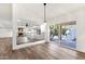Open-concept living area with wood floors, fireplace, and large sliding doors to the backyard at 3037 E Bighorn Ave, Phoenix, AZ 85048