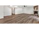 Large living room featuring wood floors, a stone fireplace, recessed lighting, and a ceiling fan at 3037 E Bighorn Ave, Phoenix, AZ 85048