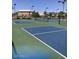 A picturesque view of blue and green community tennis courts on a sunny day at 3037 E Bighorn Ave, Phoenix, AZ 85048