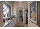 Hallway with shuttered window, built in storage, and decor leading to another room at 31085 N 72Nd Pl, Scottsdale, AZ 85266