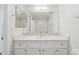 Bathroom featuring white cabinets, granite countertops, and updated fixtures at 3301 E Earll Dr # 210, Phoenix, AZ 85018