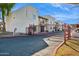 Exterior view of gated condo community with mature trees, landscape and speedbump at 3301 E Earll Dr # 210, Phoenix, AZ 85018