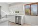 Beautiful kitchen with stainless steel appliances, white countertops, and a tiled backsplash at 3301 E Earll Dr # 210, Phoenix, AZ 85018