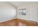 Bright living room features wood flooring, natural light, and neutral paint palette at 3301 E Earll Dr # 210, Phoenix, AZ 85018