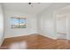 Inviting living room with natural light, wood flooring, and vaulted ceiling at 3301 E Earll Dr # 210, Phoenix, AZ 85018