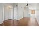 Bright living room boasts wood flooring, ceiling fan, and neutral paint palette at 3301 E Earll Dr # 210, Phoenix, AZ 85018