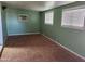 A bright bedroom with a window and neutral flooring at 3618 W Las Palmaritas Dr, Phoenix, AZ 85051