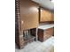 Kitchen featuring wood cabinets, countertops and a brick fireplace at 3618 W Las Palmaritas Dr, Phoenix, AZ 85051