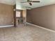 The living room features neutral flooring, a brick fireplace and a ceiling fan at 3618 W Las Palmaritas Dr, Phoenix, AZ 85051