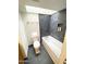 Modern bathroom featuring a tiled shower with skylight and a sleek white soaking tub at 3637 E Monterosa St # 5, Phoenix, AZ 85018