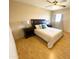 Comfortable bedroom with neutral tones, wood floors, and large windows at 3637 E Monterosa St # 5, Phoenix, AZ 85018