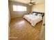 Bright bedroom with natural light, wood floors, closet, and cozy decor at 3637 E Monterosa St # 5, Phoenix, AZ 85018