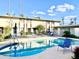 Relaxing community pool area with comfortable lounge chairs, tables, and umbrellas at 3637 E Monterosa St # 5, Phoenix, AZ 85018