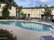 Inviting community pool with lounge chairs and tables, perfect for relaxation at 3637 E Monterosa St # 5, Phoenix, AZ 85018