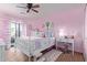 Charming bedroom featuring light pink walls, a white metal bed, and lots of natural light at 36801 N Long Rifle Rd, Carefree, AZ 85377