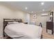 Cozy bedroom featuring wood floors, recessed lighting, and mini-split AC unit at 36801 N Long Rifle Rd, Carefree, AZ 85377