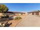 Desert home with detached garage, desert landscaping, private courtyard, and circular driveway at 36801 N Long Rifle Rd, Carefree, AZ 85377
