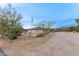 Desert home with flag pole, beautiful desert landscaping including cactus and native trees at 36801 N Long Rifle Rd, Carefree, AZ 85377
