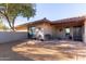 Home entrance featuring desert landscaping, seating, brick walkway and desert plants at 36801 N Long Rifle Rd, Carefree, AZ 85377