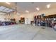 Spacious garage with ample storage, overhead lighting, and epoxy flooring at 36801 N Long Rifle Rd, Carefree, AZ 85377