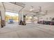 Spacious four-car garage with an open view of the outdoors and plenty of storage space at 36801 N Long Rifle Rd, Carefree, AZ 85377