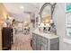Light and airy hallway featuring a stylish grey vanity with a marble top, mirror and decor at 36801 N Long Rifle Rd, Carefree, AZ 85377
