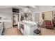 Well-appointed kitchen featuring a large island with seating and granite countertops at 36801 N Long Rifle Rd, Carefree, AZ 85377