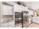 Bright kitchen with stainless steel appliances, white cabinets, and granite countertops at 36801 N Long Rifle Rd, Carefree, AZ 85377