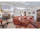 Comfortable living room and dining area featuring a leather sofa and elegant dining set at 36801 N Long Rifle Rd, Carefree, AZ 85377