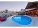 Backyard oasis featuring a private pool and covered patio area at 36801 N Long Rifle Rd, Carefree, AZ 85377