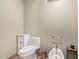 Minimalist powder room features a white toilet, bidet, and neutral paint at 36801 N Long Rifle Rd, Carefree, AZ 85377
