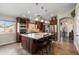 Spacious kitchen showcases an oversized island with seating and modern pendant lighting at 3689 N Crane Pl, Casa Grande, AZ 85122