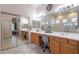 Spacious bathroom features double sinks, ample countertop space, and large mirrors at 3820 E Carson Rd, Phoenix, AZ 85042