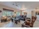 Spacious living room with tile floors, plush sofas, and a neutral color palette at 3820 E Carson Rd, Phoenix, AZ 85042