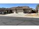 Inviting home with a three-car garage and well-maintained desert landscaping at 39642 N Oxford Way, San Tan Valley, AZ 85140