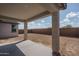 Covered back patio with views of the yard, perfect for outdoor enjoyment at 4022 S 178Th Ln, Goodyear, AZ 85338