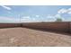 Large, undeveloped backyard awaiting your landscaping ideas at 4022 S 178Th Ln, Goodyear, AZ 85338
