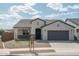 Charming single-story home with a well-manicured desert landscape and a two-car garage at 4022 S 178Th Ln, Goodyear, AZ 85338