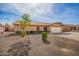 Inviting single-Gathering home with low-maintenance front yard and a two-car garage in a quiet neighborhood at 4133 W Wood Dr, Phoenix, AZ 85029