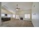 Open-concept living room featuring a fireplace, adjacent kitchen, and ample space for entertaining at 4206 E Cathedral Rock Dr, Phoenix, AZ 85044