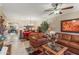 Brightly lit living room area, featuring a ceiling fan and an open floor plan at 42829 W Wild Horse Trl, Maricopa, AZ 85138